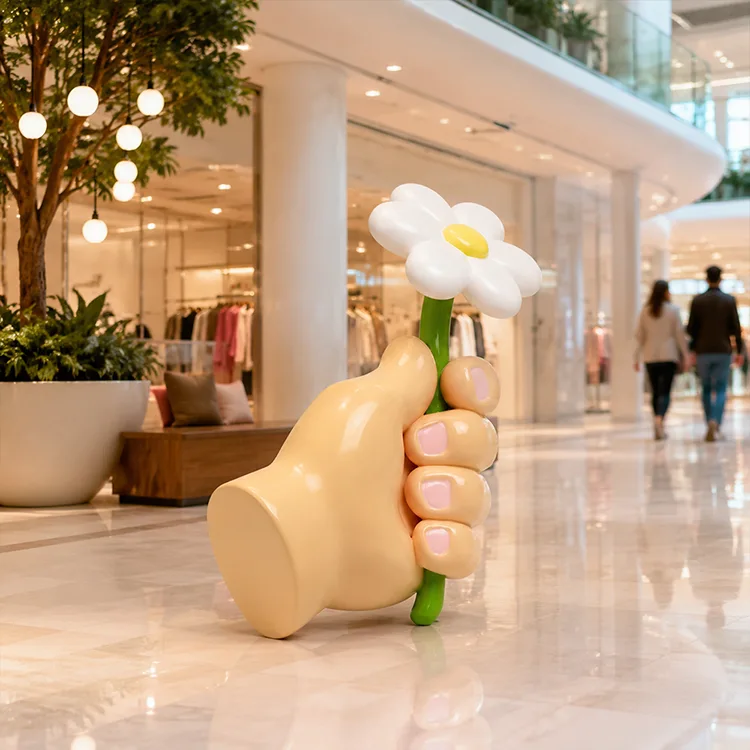 Håndholder blomsterskulptur